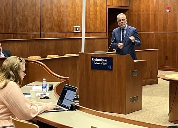 Presenter speaks on pedestal