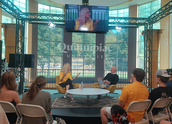 President Marie Hardin and Nick Pietruszkiewicz sitting down in the School of Communications talking