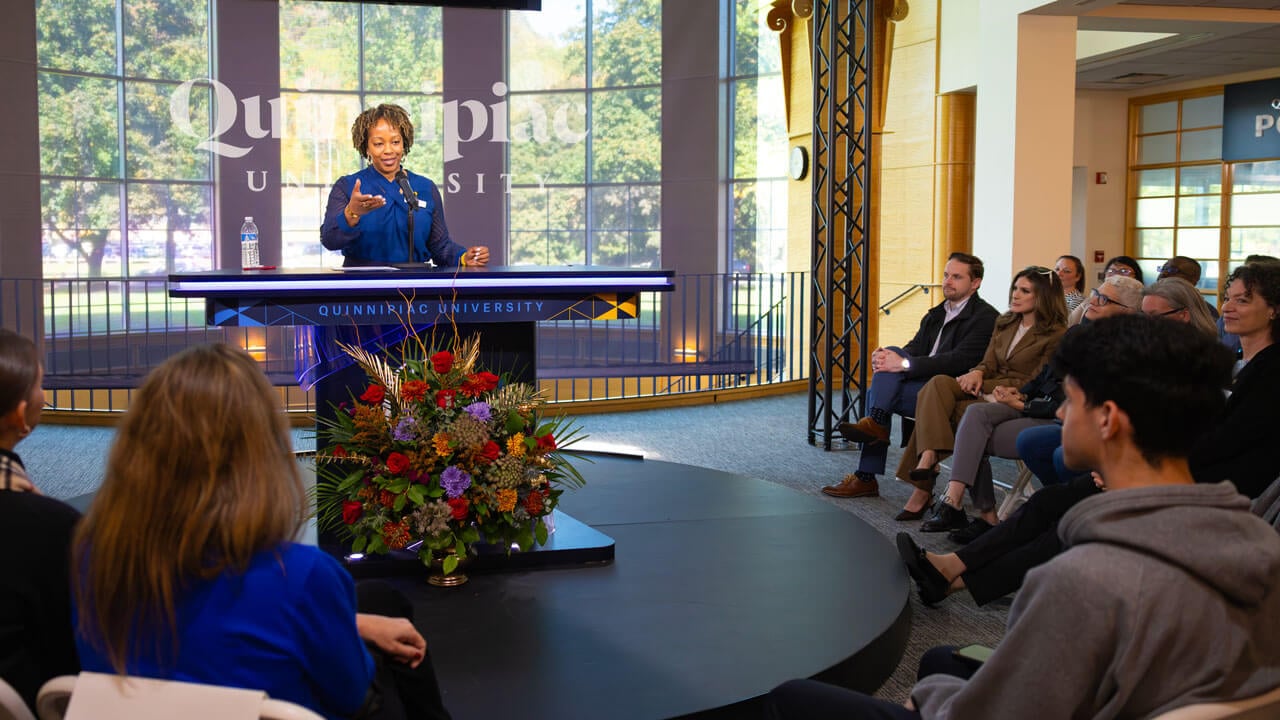 Dean Nadine Barnett Cosby talks to a crowd